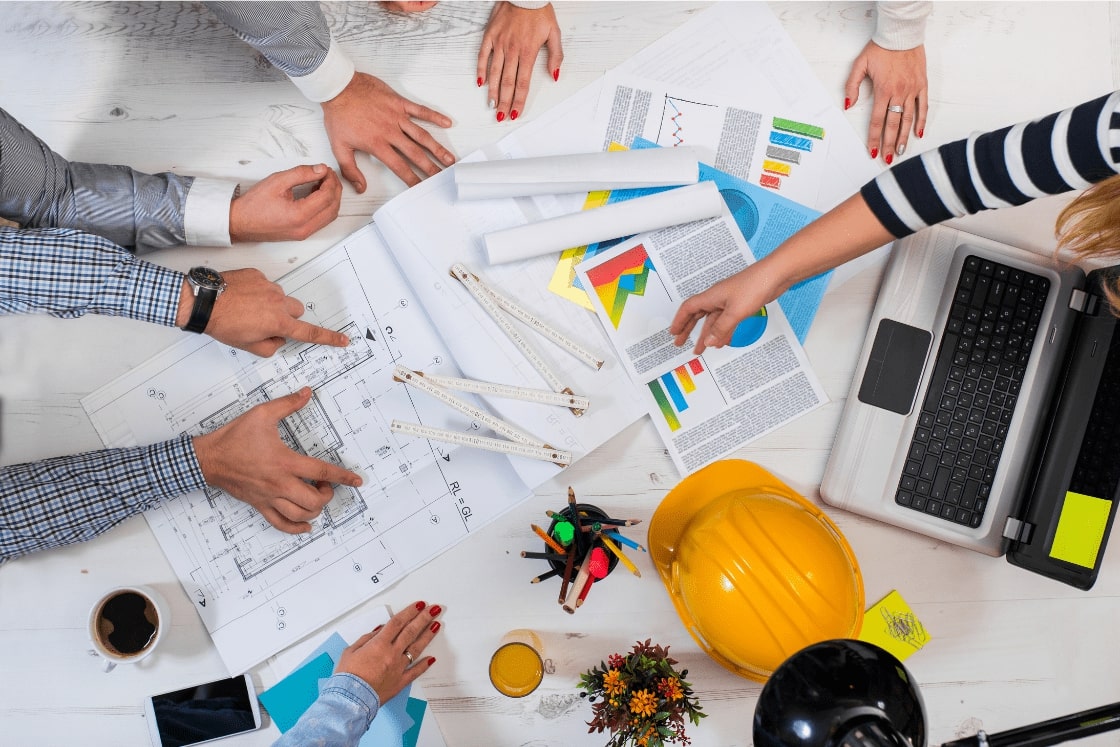 Architects and designers reviewing comprehensive design estimates. Our services offer precision from schematic to detailed construction documents, ensuring defensible and accurate preliminary estimates to help you win bids and grow your business